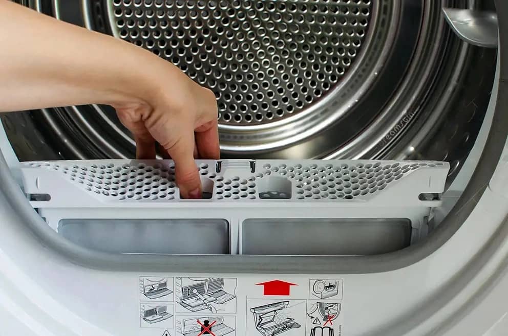 housewife-holds-lint-trap-front-loading-tumble-dryer-woman-s-hand-took-out-filter-205050483-transformed