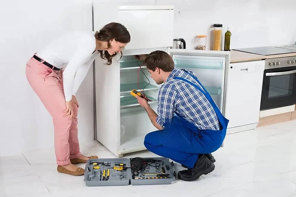 housewife-looking-worker-repairing-refrigerator-beautiful-male-kitchen-room-57711420-g0tqXK5q7